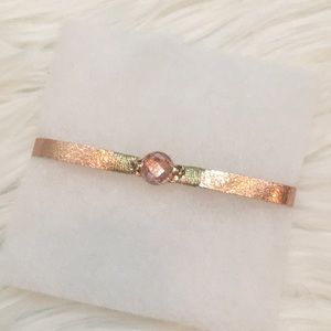 NEW Gold colored band bracelet with pink stone